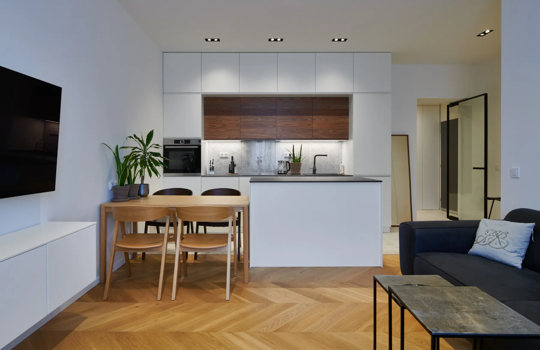 Custom kitchen with walnut doors and an island – built by Pepe Vejlupek