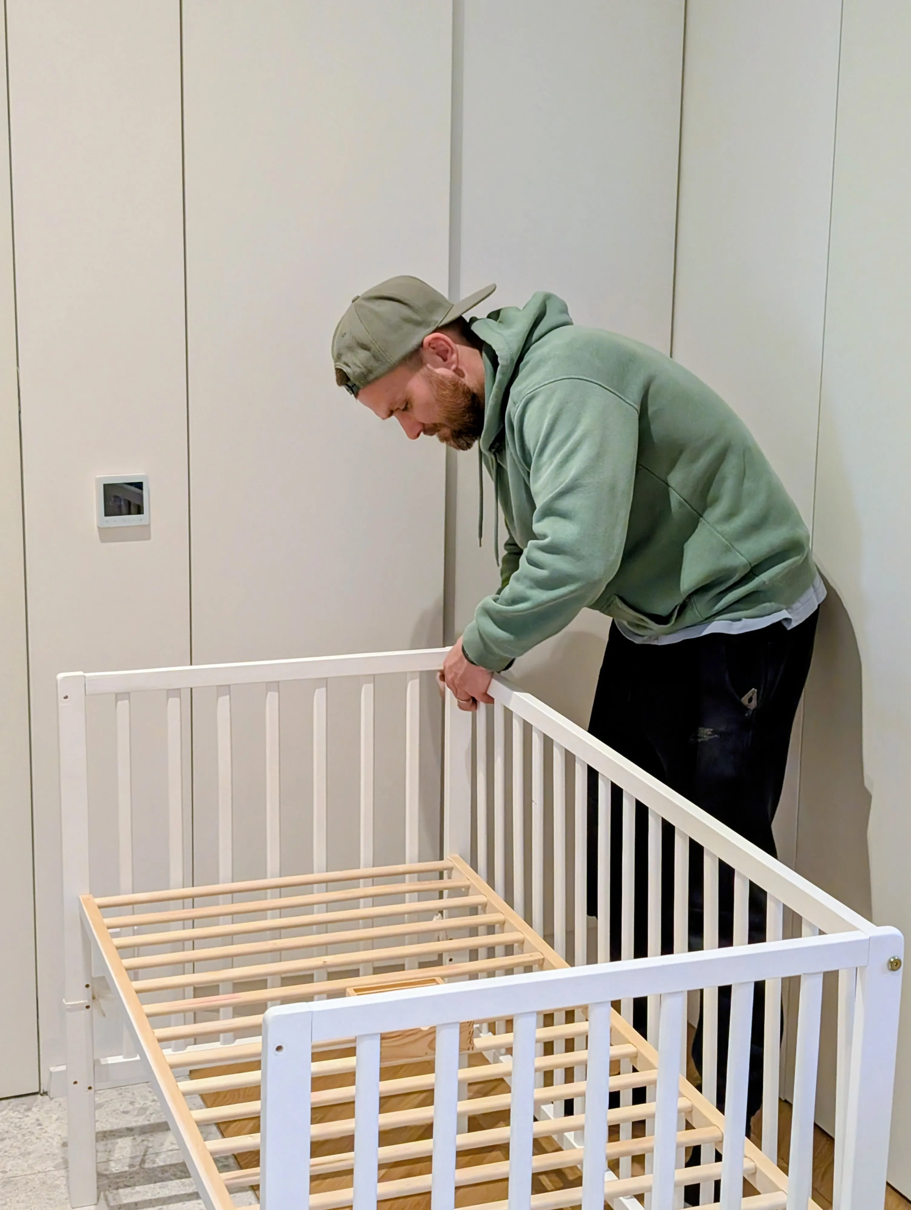 Pepe Vejlupek assembling a baby cot