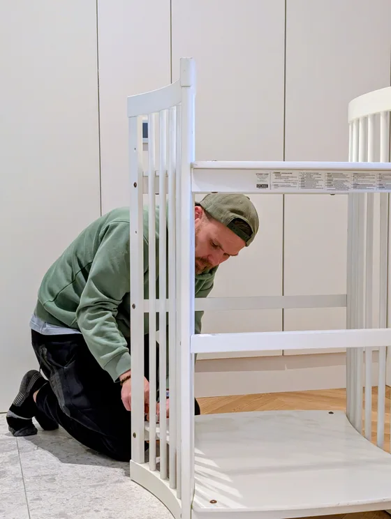 Handyman Pepe Vejlupek assembling nursery furniture