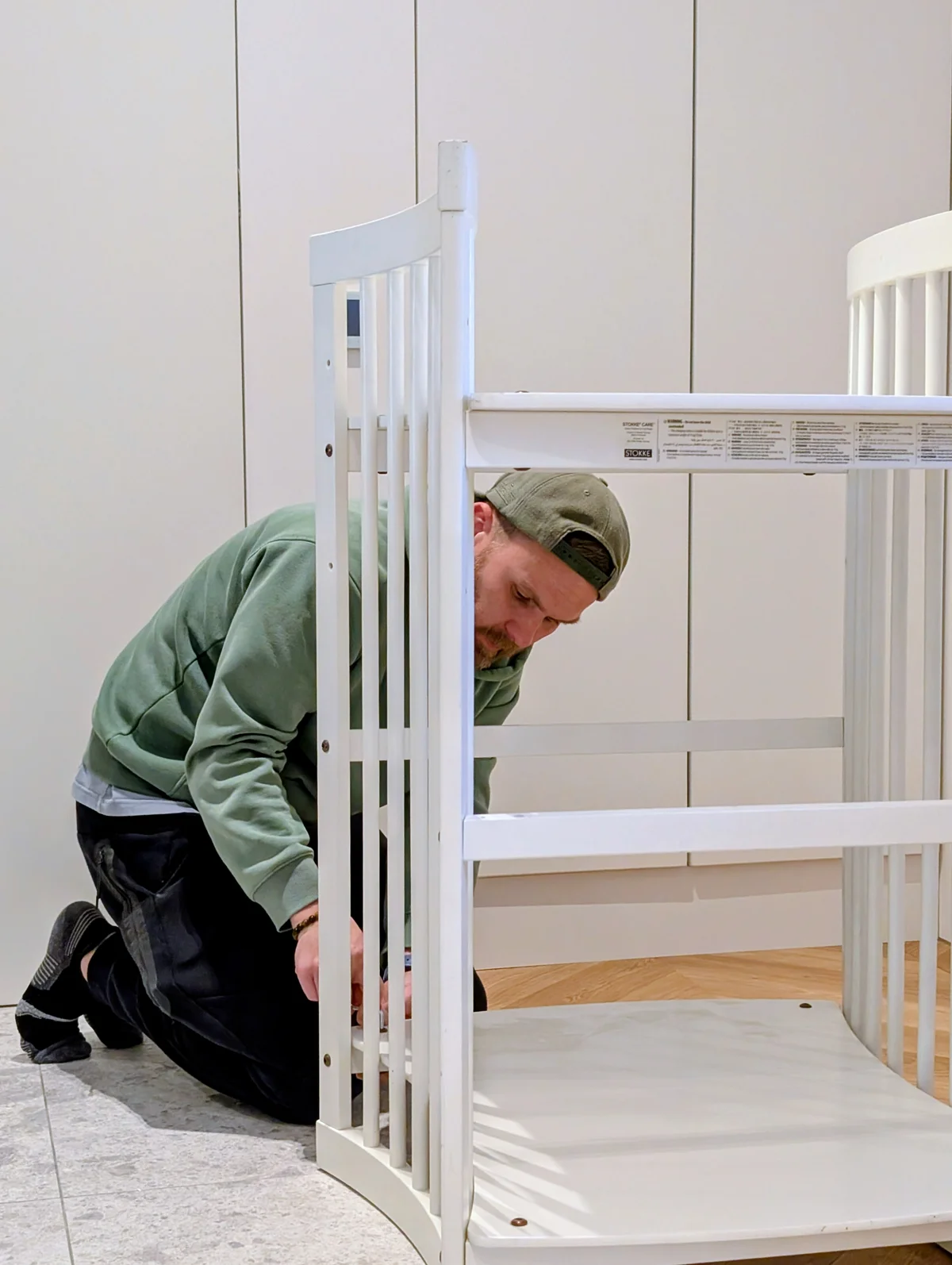 Handyman Pepe Vejlupek assembling nursery furniture