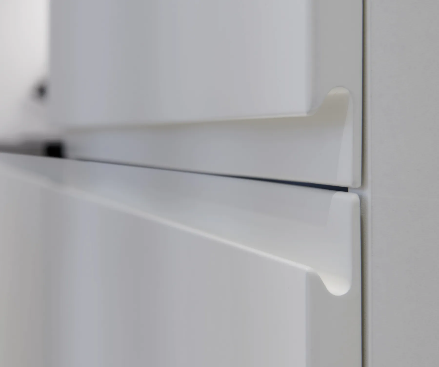 Detail of handle-less doors with routed finger pull